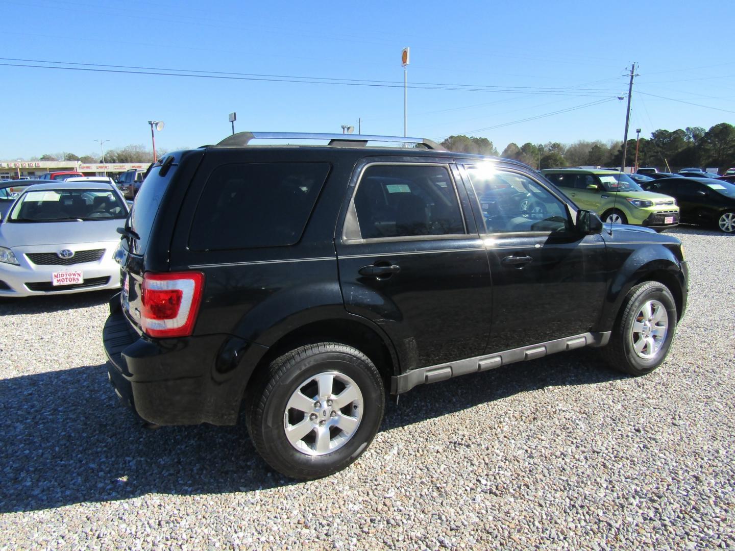 2010 Black Ford Escape Limited FWD (1FMCU0EG8AK) with an 3.0L V6 DOHC 24V engine, Automatic transmission, located at 15016 S Hwy 231, Midland City, AL, 36350, (334) 983-3001, 31.306210, -85.495277 - Photo#7